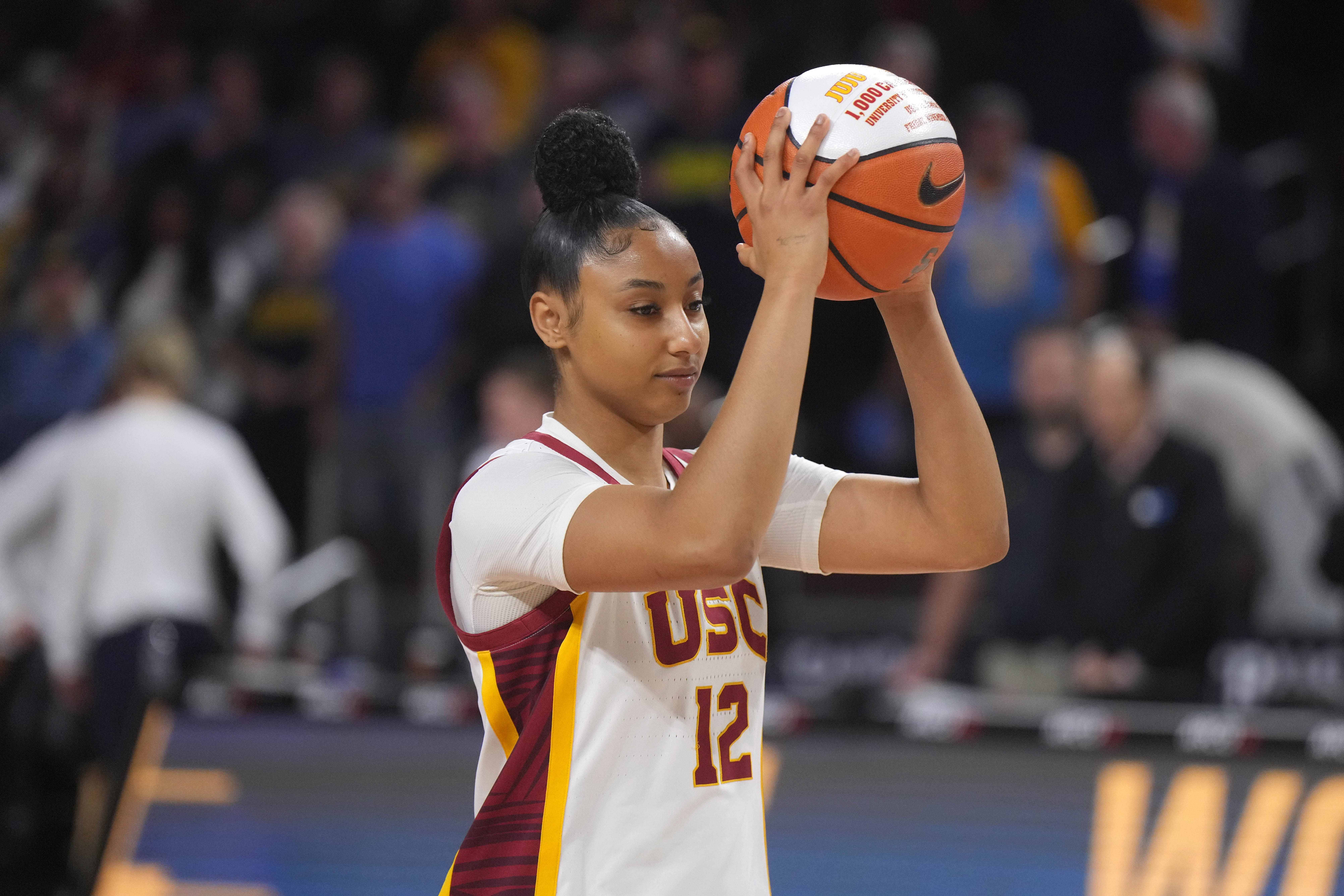 USC Trojans guard JuJu Watkins (#12) is honored for scoring her 1,000th career point before the game against the Michigan Wolverines at Galen Center. Photo: Imagn